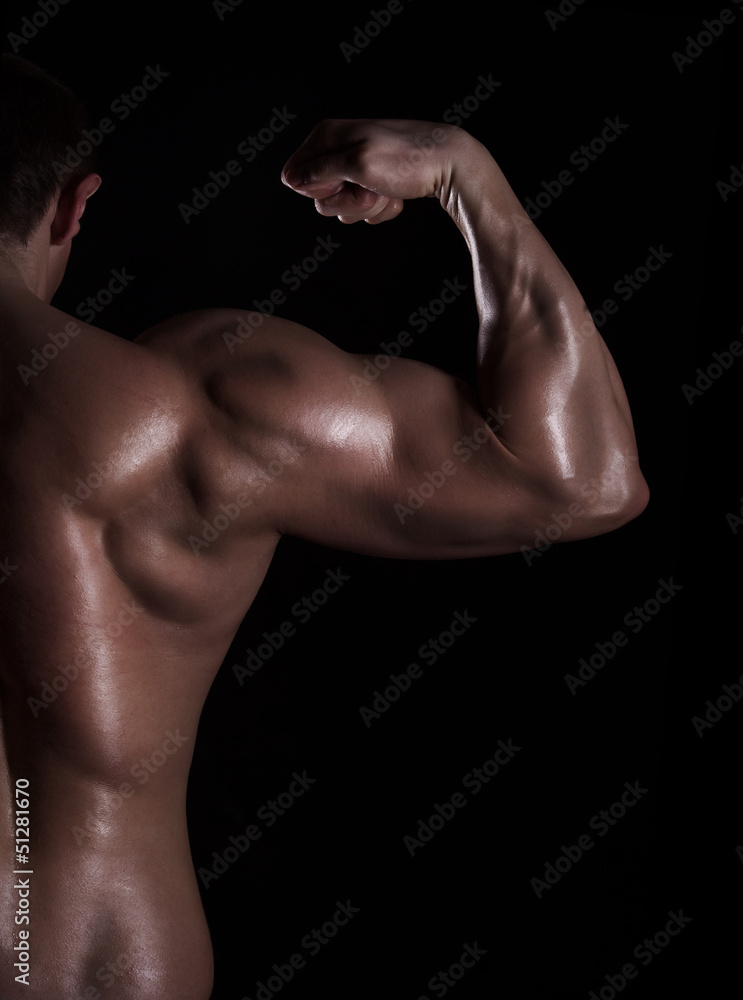 back view of a muscular man showing his biceps