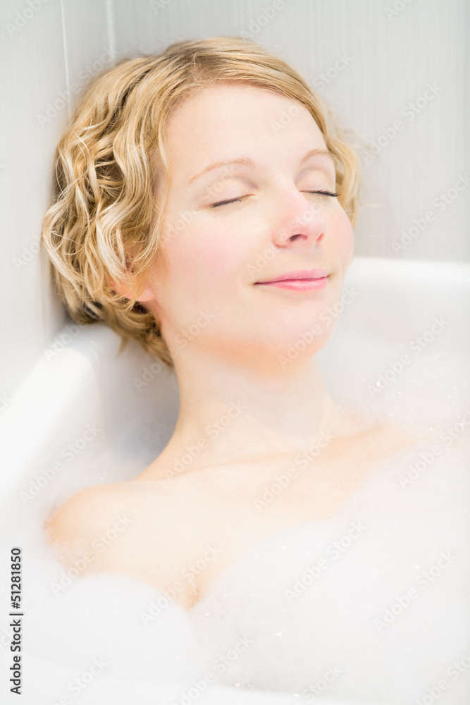 Young woman relaxing in the bath Young woman relaxing in the bath