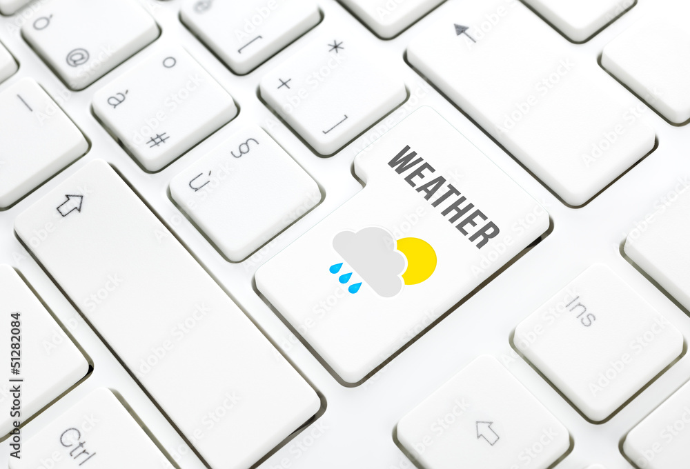 Weather on web concept. Sun cloud rain icon on a keyboard Weather on web concept. Sun cloud rain icon on a keyboard