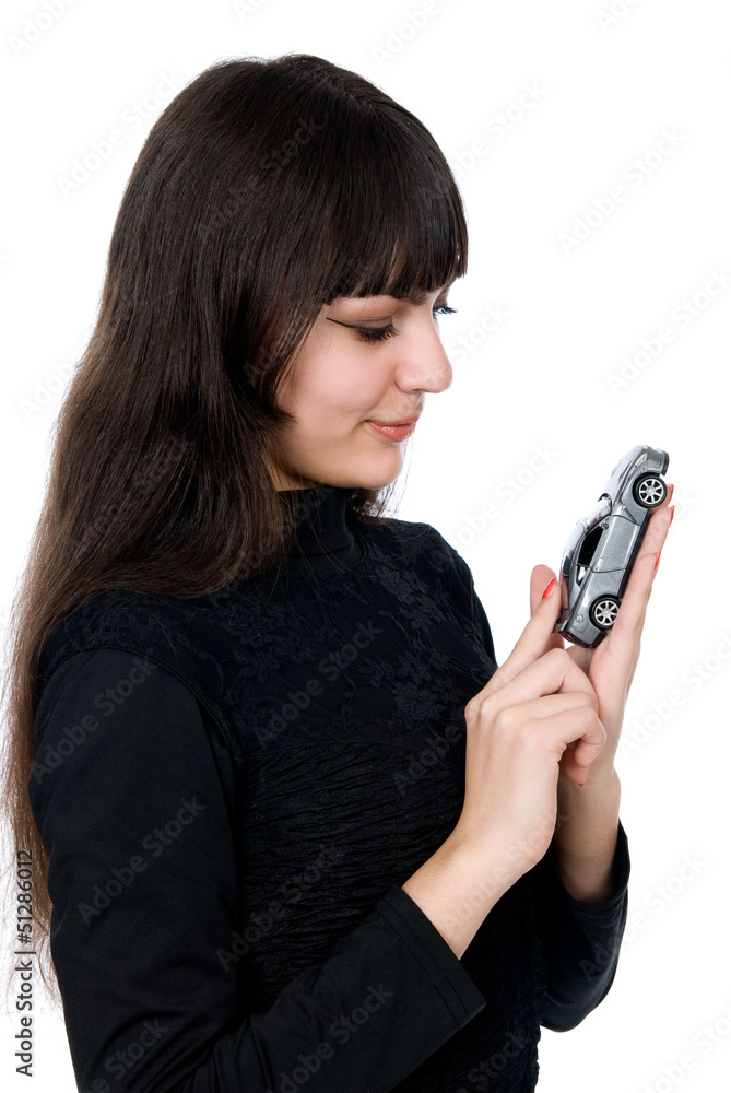 Portrait of a beautiful young woman dreaming to purchase a new c Portrait of a beautiful young woman dreaming to purchase a new c