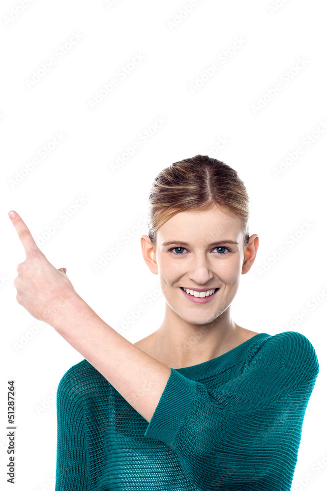Charming female model pointing away Charming female model pointing away