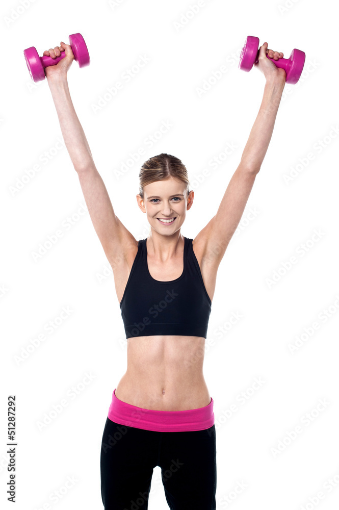 Female instructor showing how to lift dumbbells Female instructor showing how to lift dumbbells