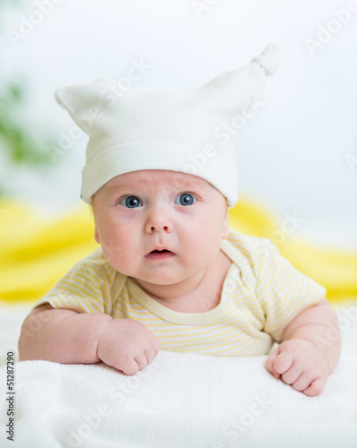 infant baby boy lying on st...