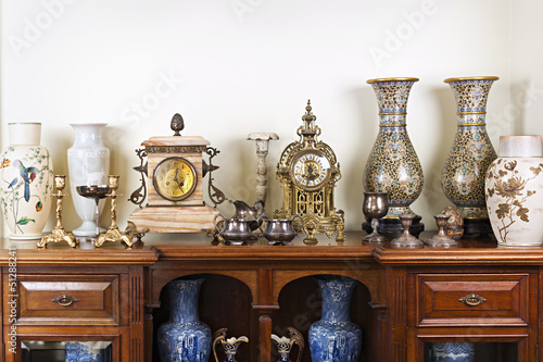 Antique vases and clocks photo