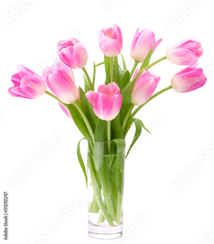 Pink tulips bouquet in vase isolated on white background © Natika
