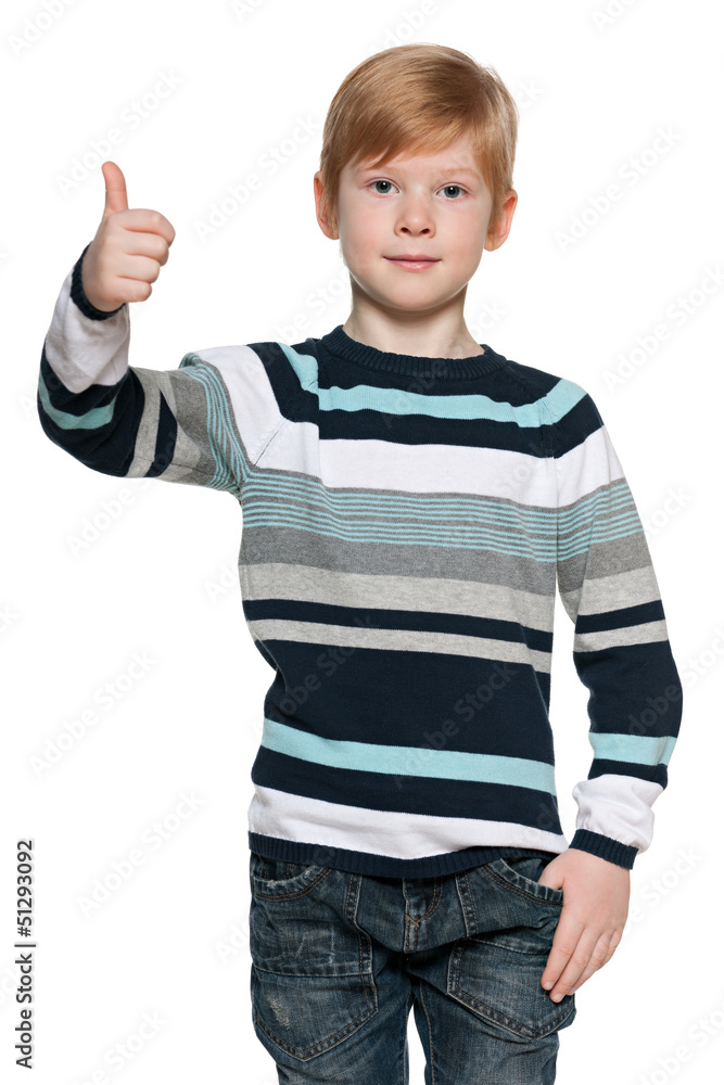 Red-haired boy holds his thumb up Red-haired boy holds his thumb up