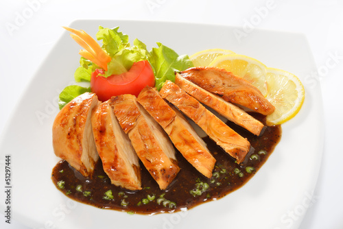 Grilled chicken breast with vegetables and black pepper sauce