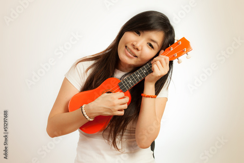 Aian woman enjoy her Ukulele