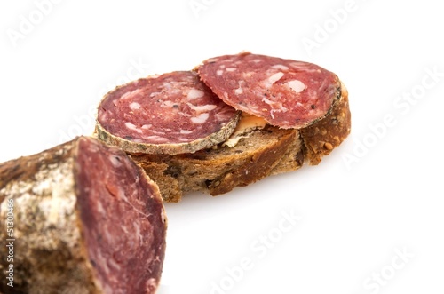 Slices of ​​sausage on bread.