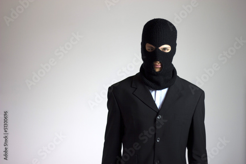 Fototapeta Naklejka Na Ścianę i Meble -  ladro (criminale) in giacca elegante