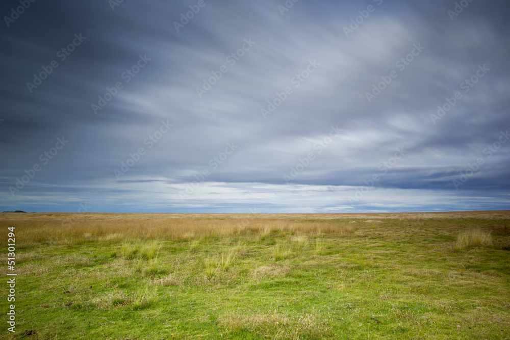 empty field and stormy sky empty field and stormy sky