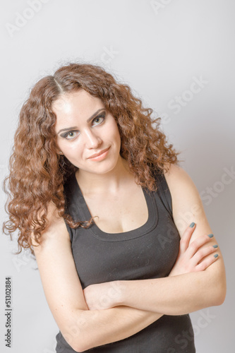 Beautiful woman with long curly hair face and shoulders