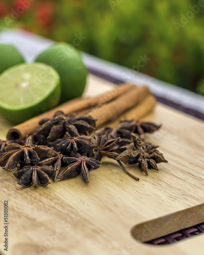 Cinnamon sticks,anise and citrus fruits arrange on wooden board