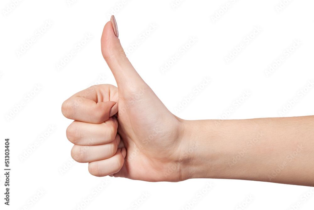 Female hand showing thumbs up sign isolated on white Female hand showing thumbs up sign isolated on white