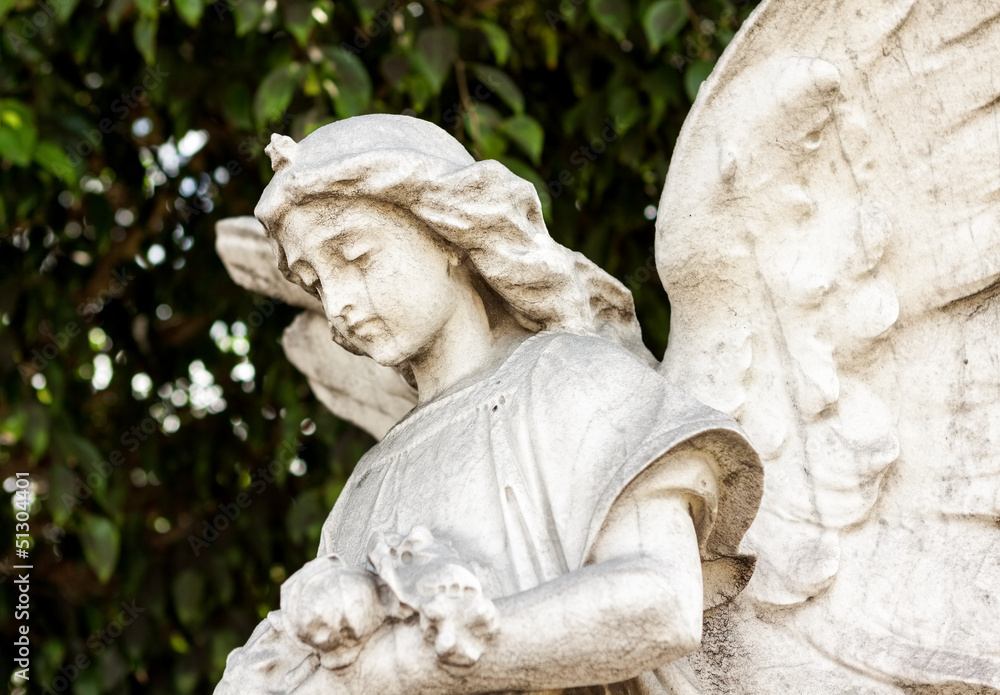 Naklejka premium Beautiful ancient female angel sculpture