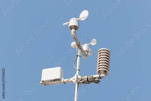 weather station against blue sky photo