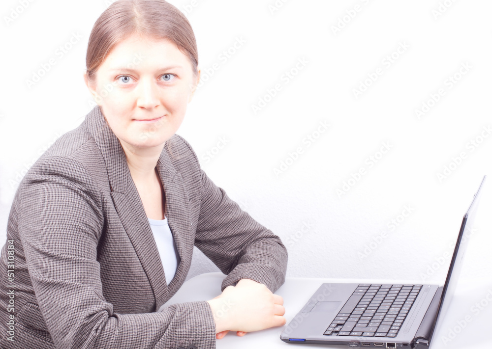 Business woman siting on a table with notebook Business woman siting on a table with notebook