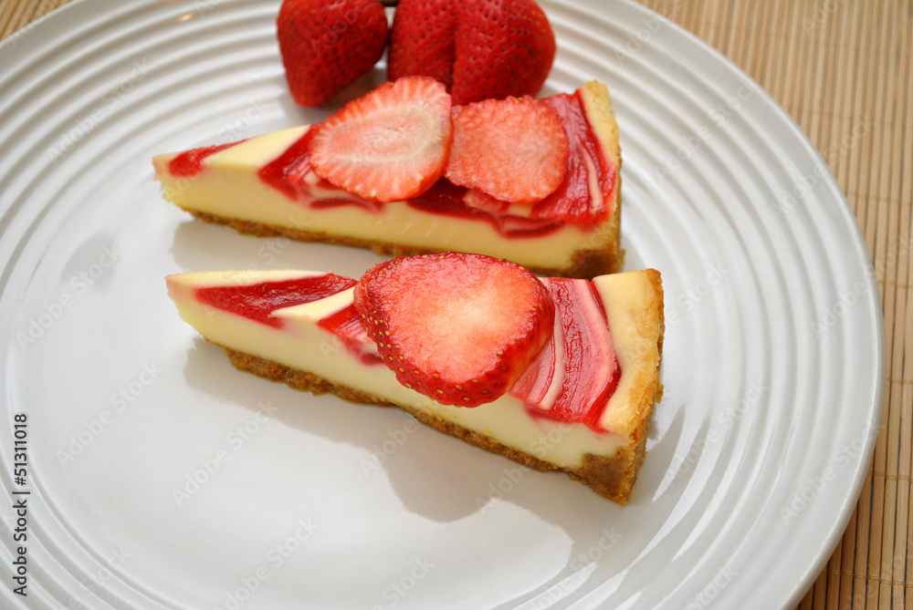 Two Slices of Strawberry Cheesecake with Fruit