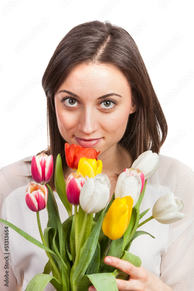 Beautiful young woman holding tulips isolated on white
