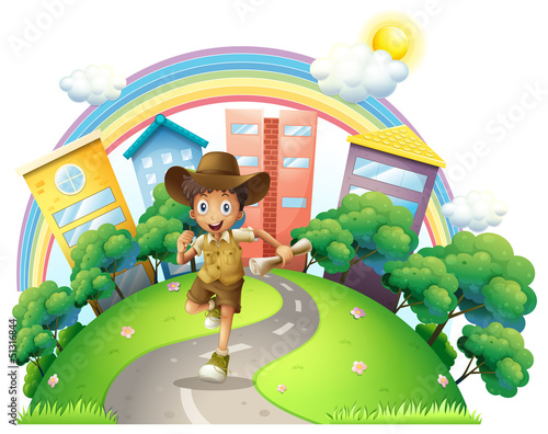 A boy running along the street