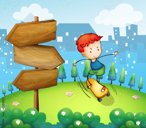 A boy playing skateboard beside the wooden arrows