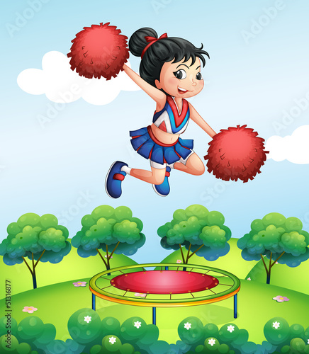 A cheerleader above a trampoline