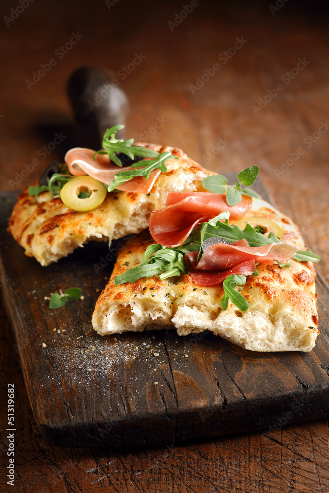 Italian focaccia bread with ham and olives