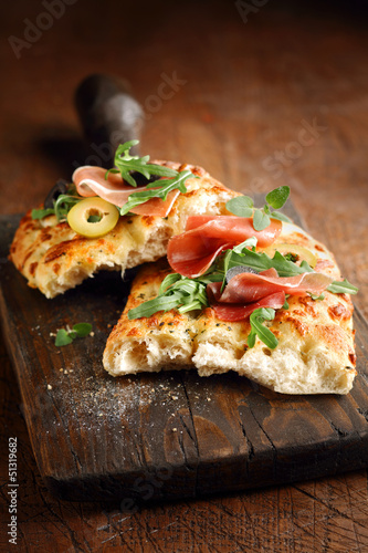 Italian focaccia bread with ham and olives