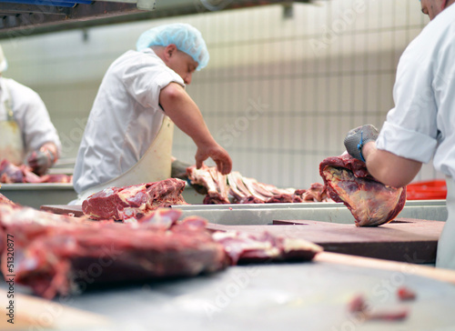 Metzger im Schlachthof // butcher in slaughterhouse photo