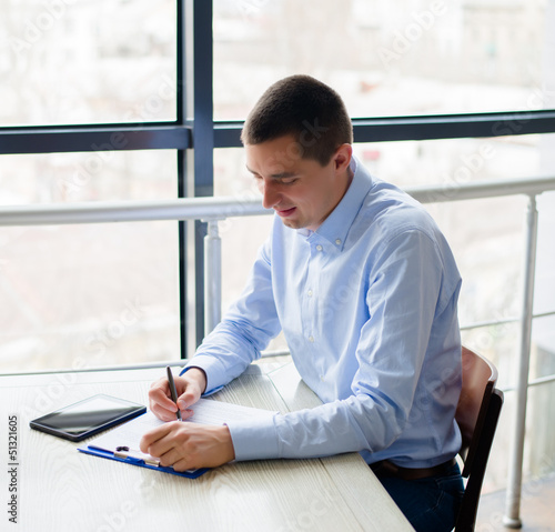 Business man  writing on paper