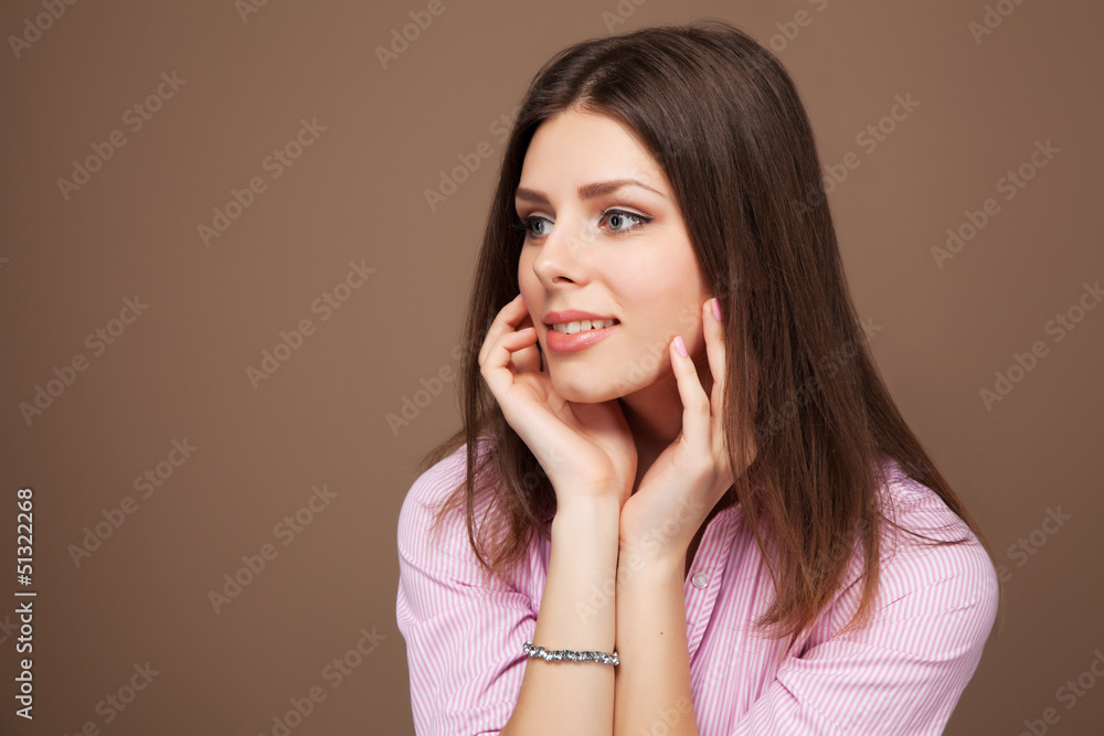 Fototapeta premium Young beautiful woman studio portrait