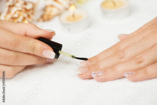Manicure treatment -  applying cuticle oil
