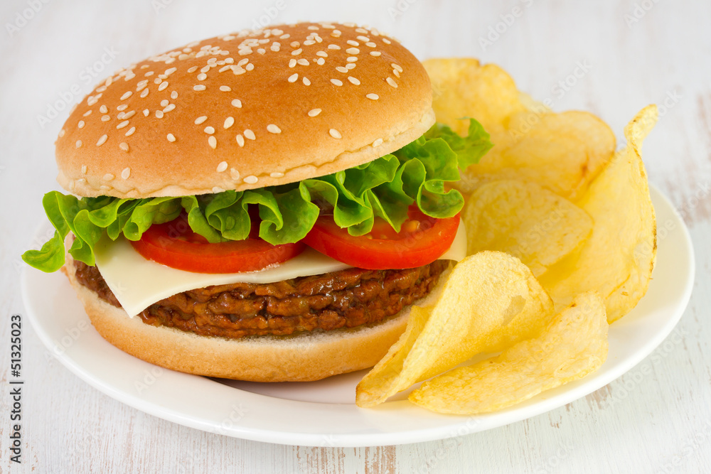 cheeseburger with chips on the plate cheeseburger with chips on the plate