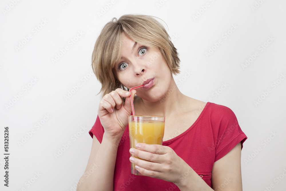 woman with big eyes drinking juice with straw woman with big eyes drinking juice with straw