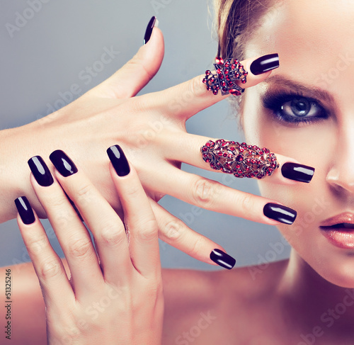 Blonde model  with burgundy manicure #51325246