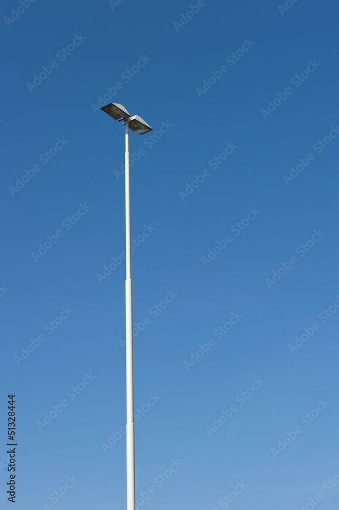 Lamppost at parking of gasstation on highway