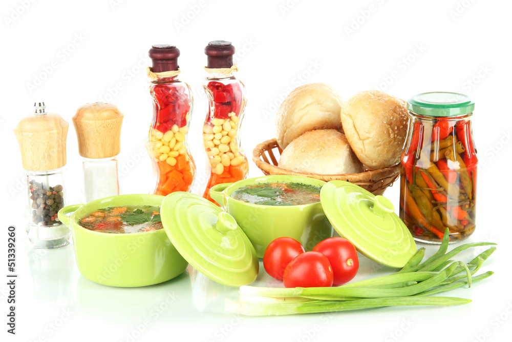 Fragrant soup in pans isolated on white Fragrant soup in pans isolated on white