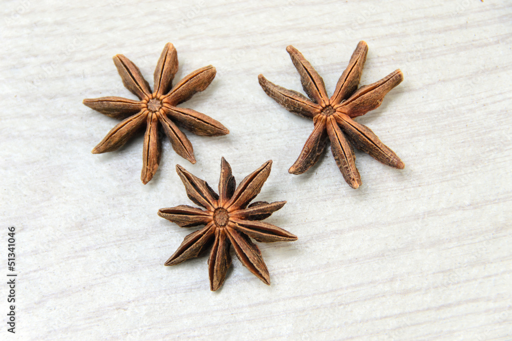 Anise spice over a white wooden background Anise spice over a white wooden background