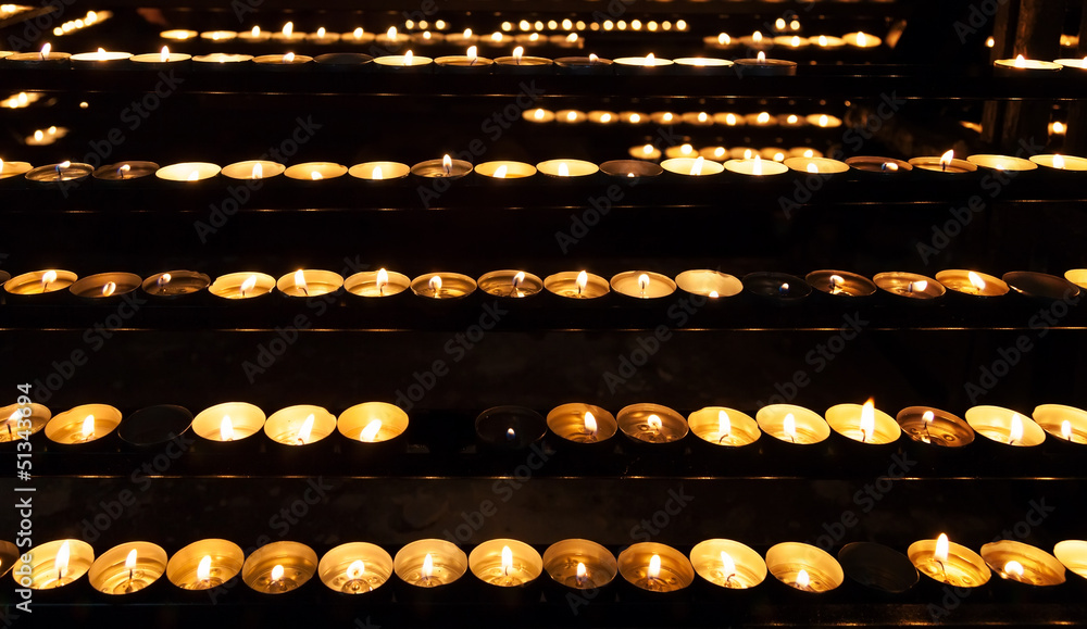 Burning candles in the St. Stephan cathedral Burning candles in the St. Stephan cathedral