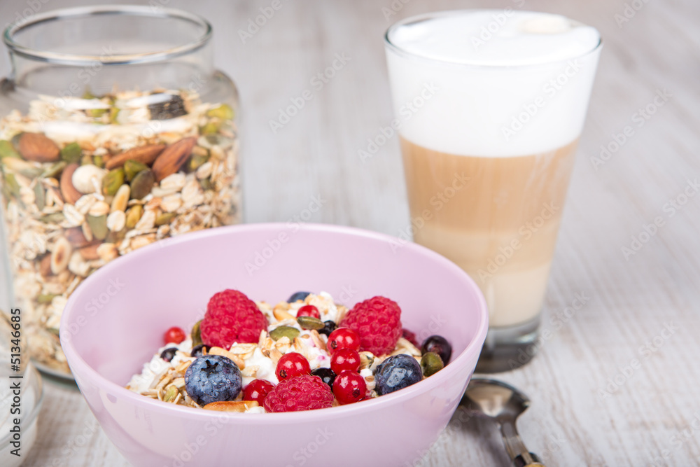 Healthy breakfast with muesli, milk, berries and coffee Healthy breakfast with muesli, milk, berries and coffee