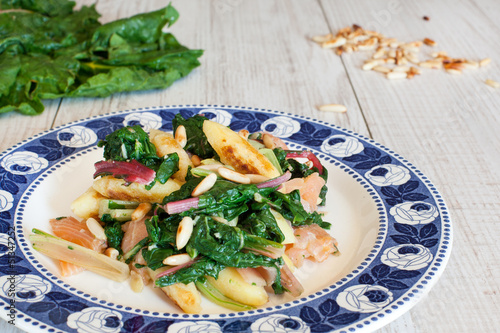 Fresh salad with chard and pine nuts