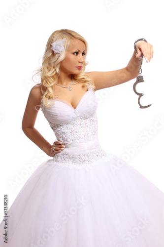 bride in handcuffs. beautiful blonde thinking isolated
