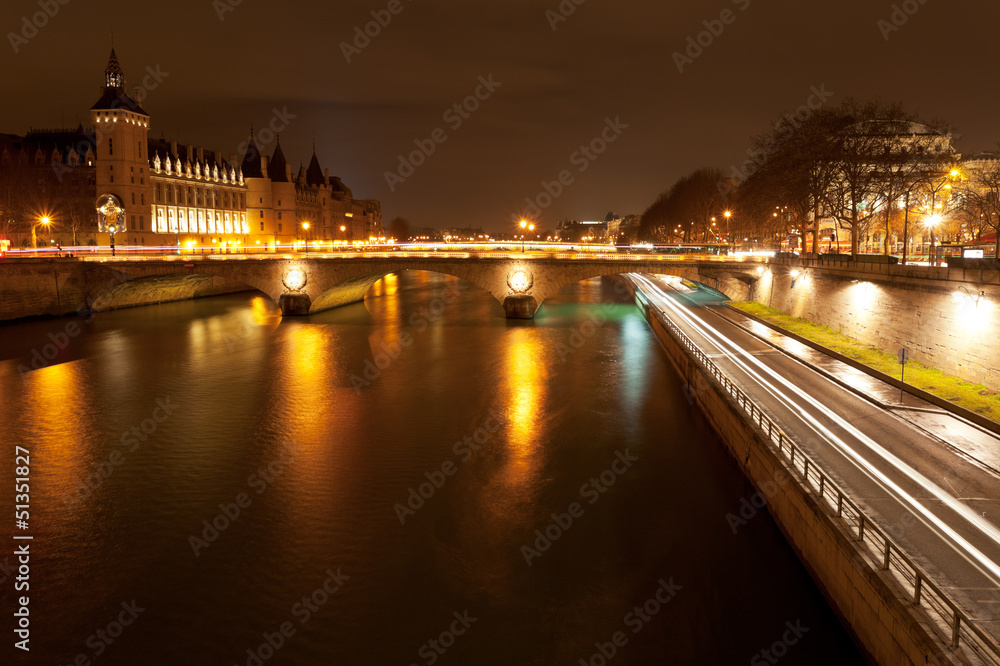 quay and pont au change in Paris at night