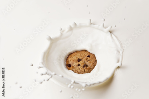 Cookie Splashing in milk. photo