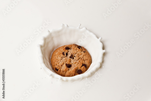 Cookie Splashing in milk. photo