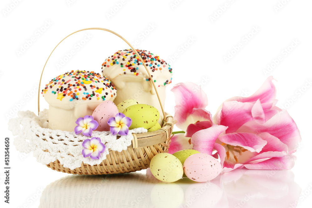 Easter cakes with eggs in wicker basket isolated on white Easter cakes with eggs in wicker basket isolated on white