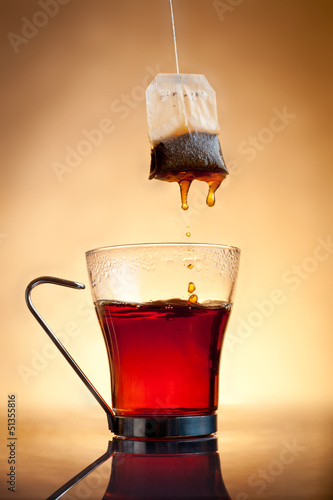 Cup of hot tea with teabag photo