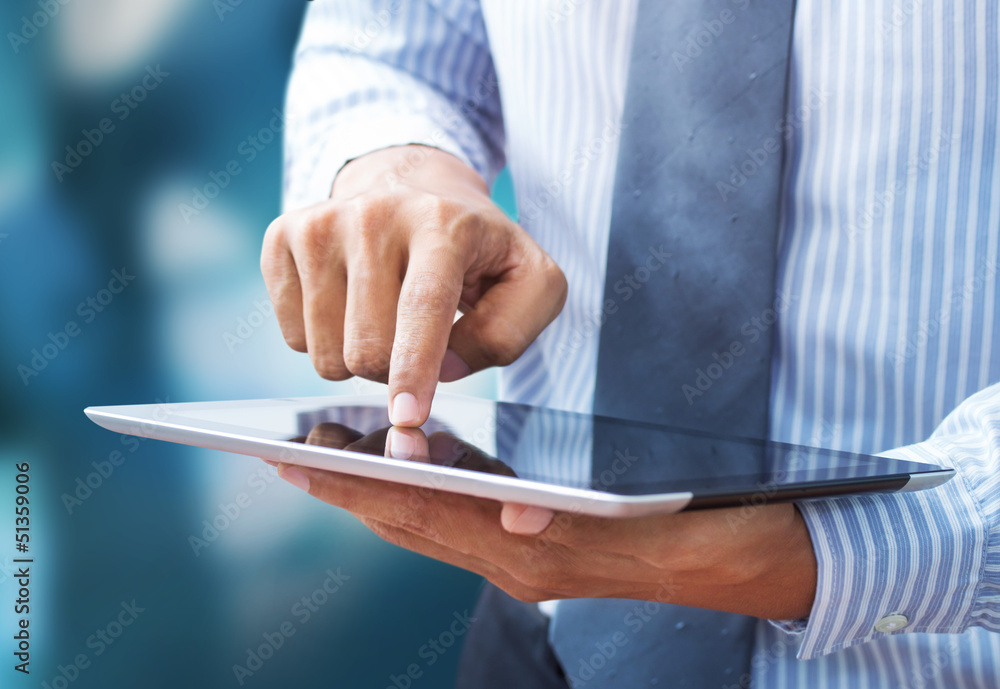 Business hand presses on screen digital tablet Business hand presses on screen digital tablet