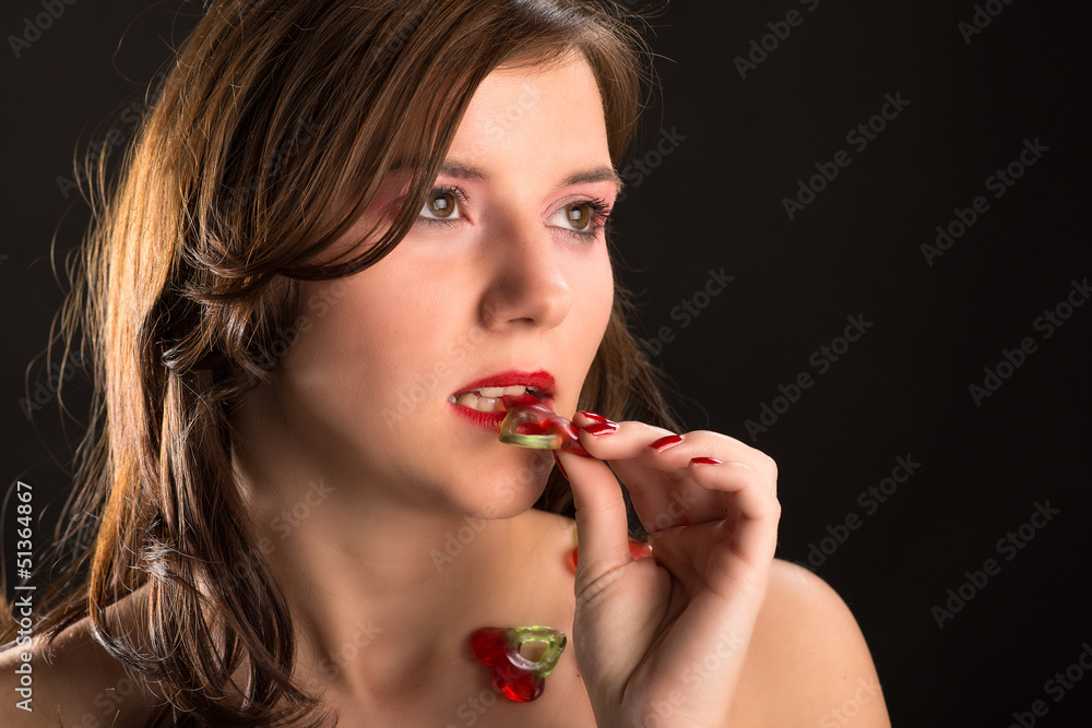 young an beautiful girl eat jellybaby cherries young an beautiful girl eat jellybaby cherries