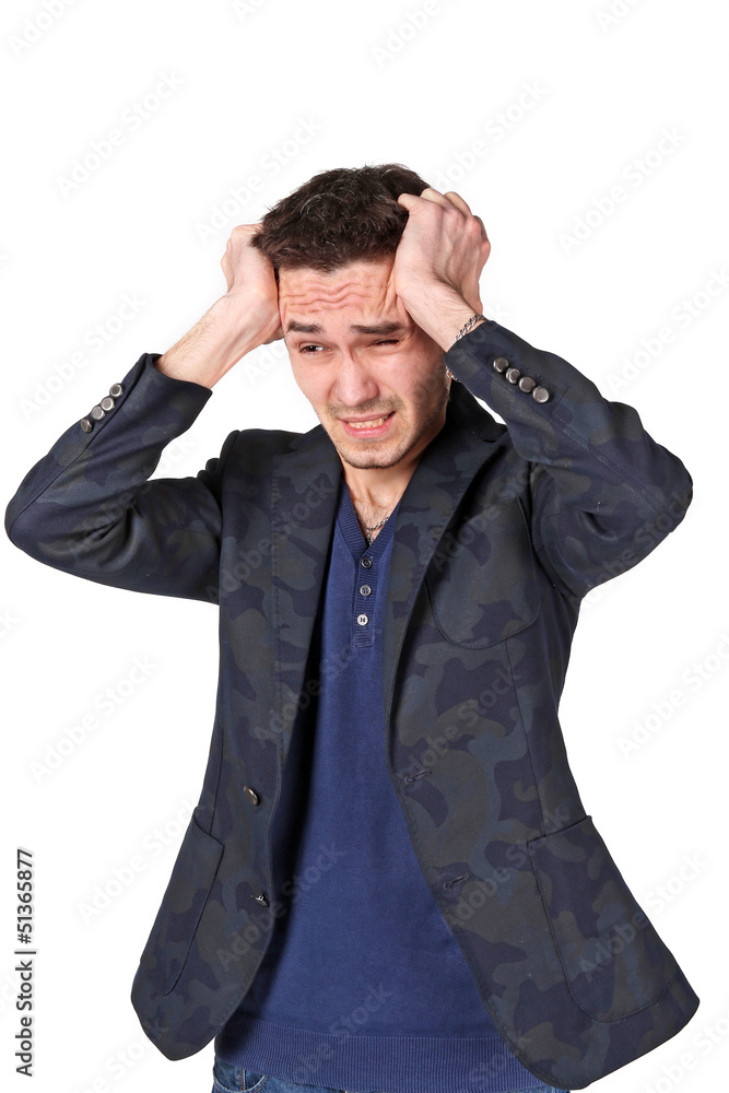 Upset man portrait grabbing his head Upset man portrait grabbing his head